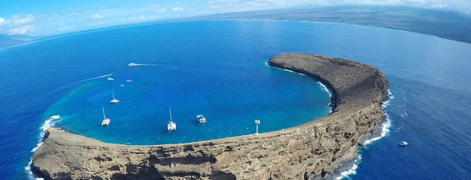 Aerial Photograph of Molokini Crater with Maui off in the horizon